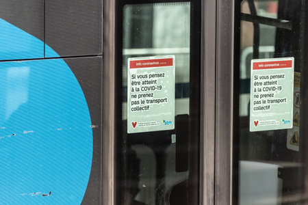 Montreal, CA - 8 May 2020: Sign in poor french on the door of a bus asking people not to board if...