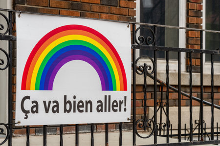 Montreal, CA - 27 April 2020: Ca va bien aller (Its going to be ok) message and rainbow on a balcony during the Covid 19 pandemy Montreal, CA - 27 April 2020: Ca va bien aller (Its going to be ok) message and rainbow on a balcony during the Covid 19 pandemy