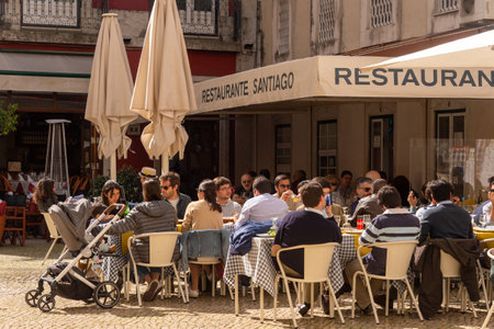 Lisbon, Portugal - 8 March 2020: Tourists & locals having lunch at portugese restaurantのeditorial素材