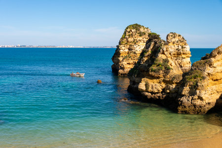 Lagos, Portugal - 7 March 2020: Atlantic ocean and cliffs at Praia do Camilo Beachのeditorial素材