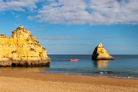 Lagos, Portugal - 4 March 2020: Lagos coastline in Portugal, Dona Ana Beach at sunsetのeditorial素材