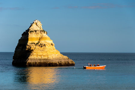 Lagos, Portugal - 4 March 2020: Lagos coastline in Portugal, Dona Ana Beach at sunsetのeditorial素材