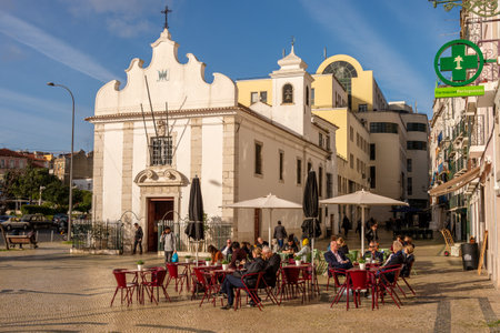 Lisbon, Portugal - 2 March 2020: People having a drink at a cafe terrace at the Praca dom Duarteのeditorial素材