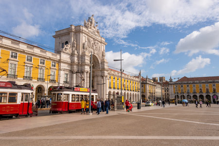 Lisbon, Portugal - 2 March 2020: two red trams 28 at the Praca do Comercio in front of Arco da Rua Augustaのeditorial素材
