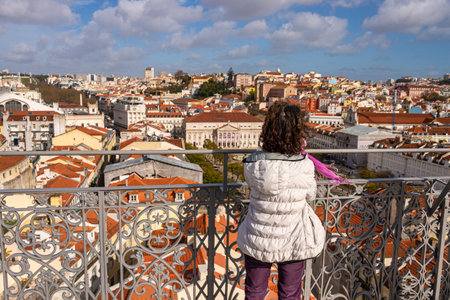 Lisbon, Portugal - 2 March 2020: Woman looking at the view from Elevador de Santa Justa.のeditorial素材