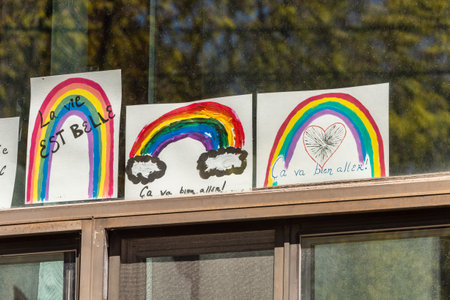 Montreal, CA - 13 May 2020: Ca va bien aller (Its going to be ok) messages and rainbow drawings on a balcony during the Covid 19 pandemy Montreal, CA - 13 May 2020: Ca va bien aller (Its going to be ok) messages and rainbow drawings on a balcony during the Covid 19 pandemy