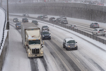 Montreal, CA - 7 February 2020: Traffic On Decarie Highway During Snow Storm