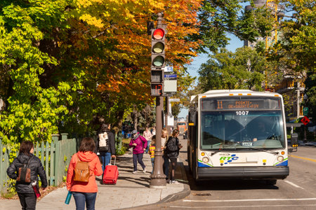 Quebec City, Canada - 5 October 2019: A RTC Bus taking on passengers on Grande Allee.のeditorial素材