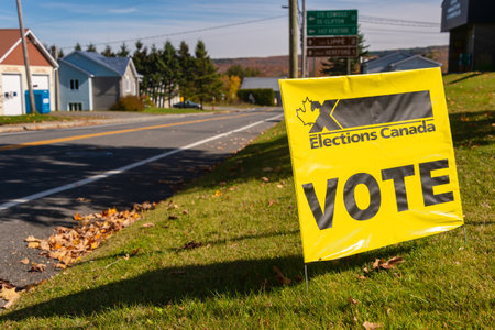 St-Hermenegilde, CA - 13 October 2019: Elections Canada Vote sign in front of a polling stationのeditorial素材