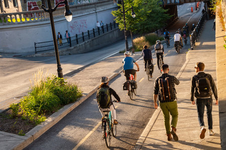 Montreal, Canada - 19 September 2019: People riding bikes on a cycle path, on Saint Laurent Boulevard.のeditorial素材