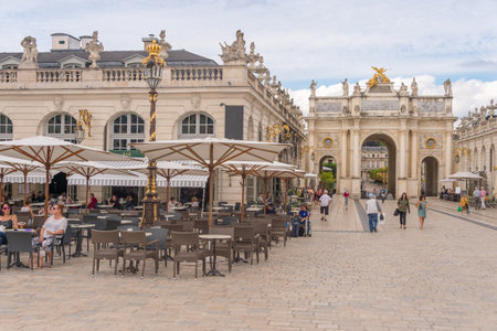 Nancy, France - 21 June 2018: Arc de Triomphe HÃ©rÃ© and CafÃ© Terrace in the Place Stanislas Square.のeditorial素材