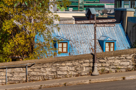 Quebec City, Canada - 5 October 2019: Detail of the fortified wall of Quebec City with an old blue roof in backgroundのeditorial素材