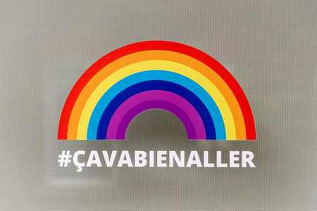 Montreal, CA - 16 May 2020: Ca va bien aller (Its going to be ok) message and rainbow sticker on a window during the Covid 19 pandemy in Montreal, Quebec. Montreal, CA - 16 May 2020: Ca va bien aller (Its going to be ok) message and rainbow sticker on a window during the Covid 19 pandemy in Montreal, Quebec.