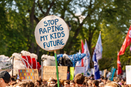 Montreal, CA - 27 September 2019: "Stop raping my kids future" Sign at the Montreal Climate March.のeditorial素材