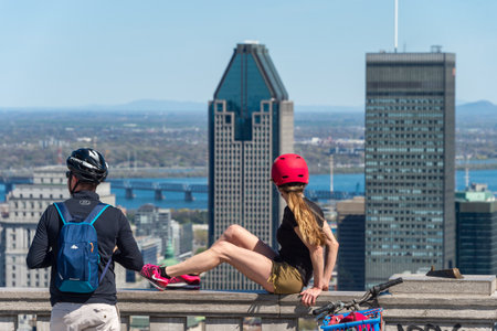 Montreal, CA - 18 May 2020: Tourists looking at Montreal skyline and enjoying a warm spring day at the Kondiaronk Belvedere.のeditorial素材
