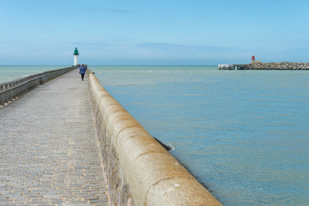 Calais, France - 19 June 2018: People walking on the west jetty in the summertime.のeditorial素材