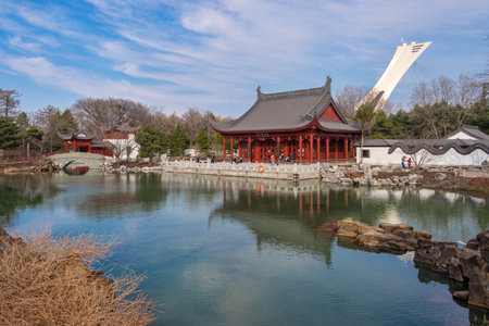Montreal, CA - 28 April 2018: Chinese Garden of the Montreal Botanical Garden, with Olympic stadium tower in background.のeditorial素材