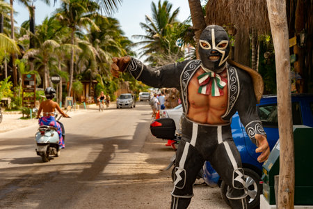 Tulum, Mexico - 14 August 2018: Mexican westler statue with traditional costume on Carretera Tulum Boca Paila road.のeditorial素材
