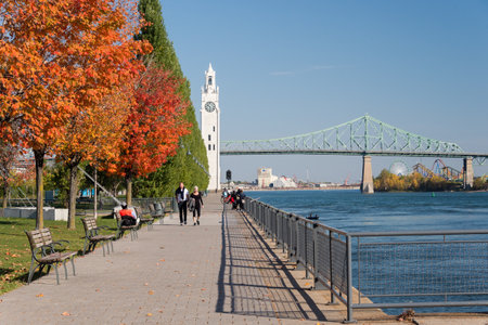Montreal, CA - 21 October 2017: Montreal Clock Tower and Jacques Cartier Bridge with autumn coloursのeditorial素材