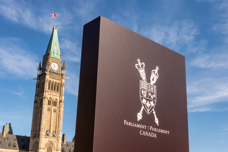Sign showing Canada Coat of Arms and Canadian Parliament Peace tower in Ottawaのeditorial素材