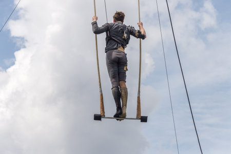 Montreal, Canada - 4 June 2017: Trapeze artist performing outside In Jeanne Mance Parkのeditorial素材