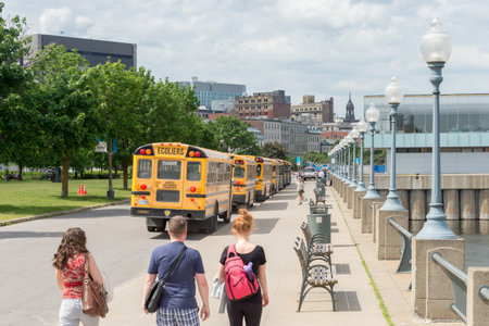 Montreal, Canada - 9 June 2017: Yellow buses parked in the old port of Montreal