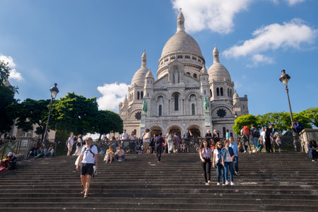 Paris, France - 25 June 2018: Tourists walking in front of Basilica Sacre Coeur in Montmartreのeditorial素材