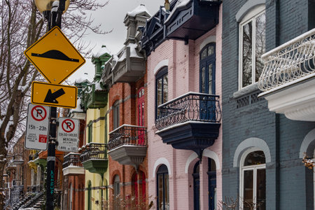 Montreal, CA - 21 November 2018: Row houses with colorful facades in the Plateau neighborhood in winter.のeditorial素材