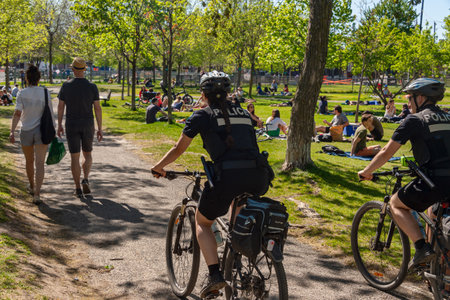 Montreal, Canada - 23 May 2020: Police patrol Laurier park to enforce the coronavirus...