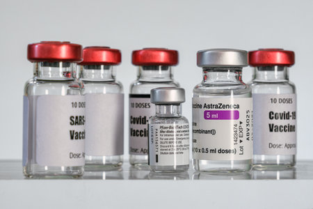 Montreal, CA - 2 March 2021: Vials of Astrazeneca & Pfizer BioNTech Covid-19 vaccinesのeditorial素材