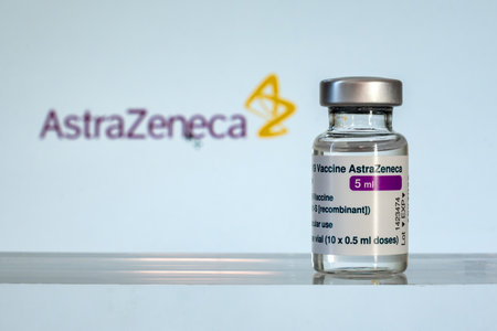 Montreal, CA - 2 March 2021: Vial of Astrazeneca Covid-19 vaccine and logo