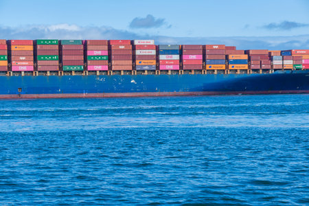 Halifax, Nova Scotia, Canada - 11 August 2021: Cargo ship sailing with hundreds of colored containersのeditorial素材