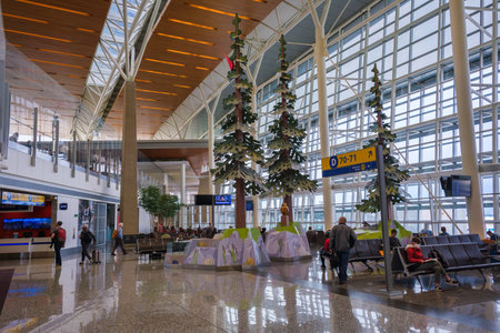 Calgary, Canada - 2 October 2021: Passengers waiting for their flights inside Calgary International Airportのeditorial素材