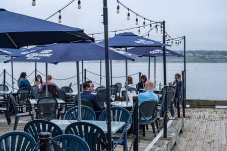 Halifax, Nova Scotia, Canada - 11 August 2021: People eating at the terrace of the Salty's restaurantのeditorial素材