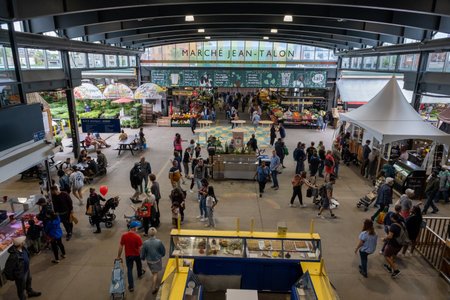 Montreal, CA, 28 May 2022: People buy groceries at Jean-Talon Market, the largest outdoor public...