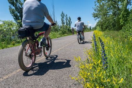 Sainte-Catherine, Canada - 11 June 2022: People riding bikes on Saint Lawrence Seaway bike patchのeditorial素材