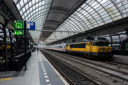 Amsterdam, The Netherlands - 21 June 2022: Nederlandse Spoorwegen Train in Amsterdam Central Station