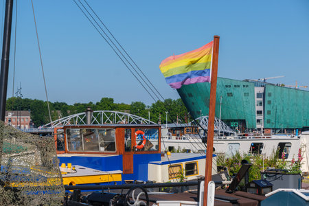 Amsterdam, Netherlands - 22 June 2022: Gay rainbow flag on a barge boat at the waterfrontのeditorial素材