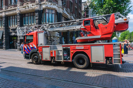 Amsterdam, Netherlands - 22 June 2022: Fire Engine driving in Amsterdamのeditorial素材