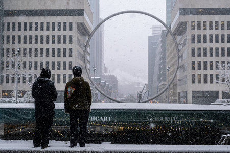 Montreal, Canada - 16 November 2022: Ring art piece in Downtown Montreal suring snow storm