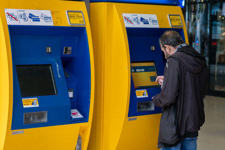 Amsterdam, The Netherlands - 8 September 2022: Passenger buys ticket in the Central railway station...