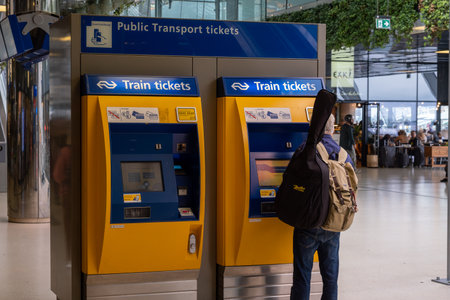 Amsterdam, The Netherlands - 8 September 2022: Passenger buys ticket in the Central railway station in Rotterdamのeditorial素材