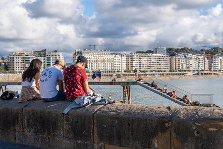 Donostia-San Sebastian, Spain - 15 September 2022: Pasarela-Embarcadero and La Concha beachのeditorial素材