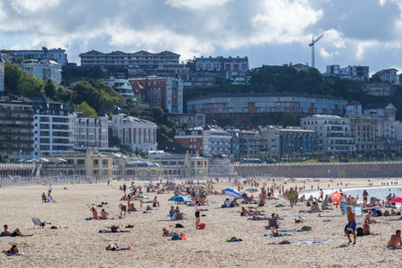 Donostia-San Sebastian, Spain - 15 September 2022: People on La Concha Beach in summerのeditorial素材