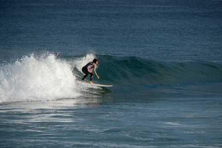 donostia-San Sebastian, Spain - 15 September 2022: Surfer on Zurriola beachのeditorial素材