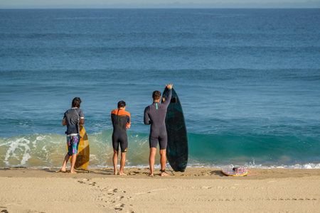 donostia-San Sebastian, Spain - 15 September 2022: Surfers on Zurriola beachのeditorial素材