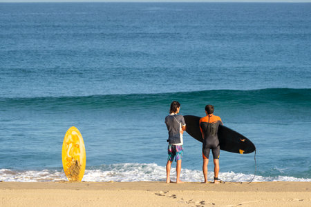 donostia-San Sebastian, Spain - 15 September 2022: Surfers on Zurriola beach