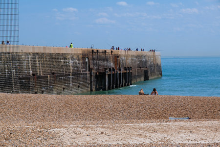 Folkestone, UK - 9 July 2023: People on Sunny sands beach enjoying the beautiful sunshineのeditorial素材