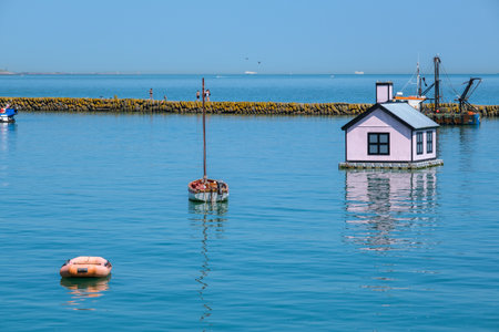 Folkestone, UK - 9 July 2023: Blue bungalow by Richard Woods floating in the harbourのeditorial素材