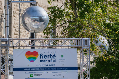Montreal, CA - 4 August 2022: Disco ball and sign for Montreal pride week "FiertÃ© Montreal"のeditorial素材